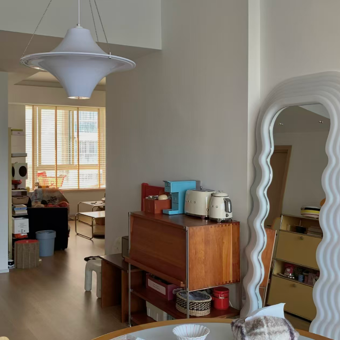 White star-shaped disc pendant light with hanging suspension cords