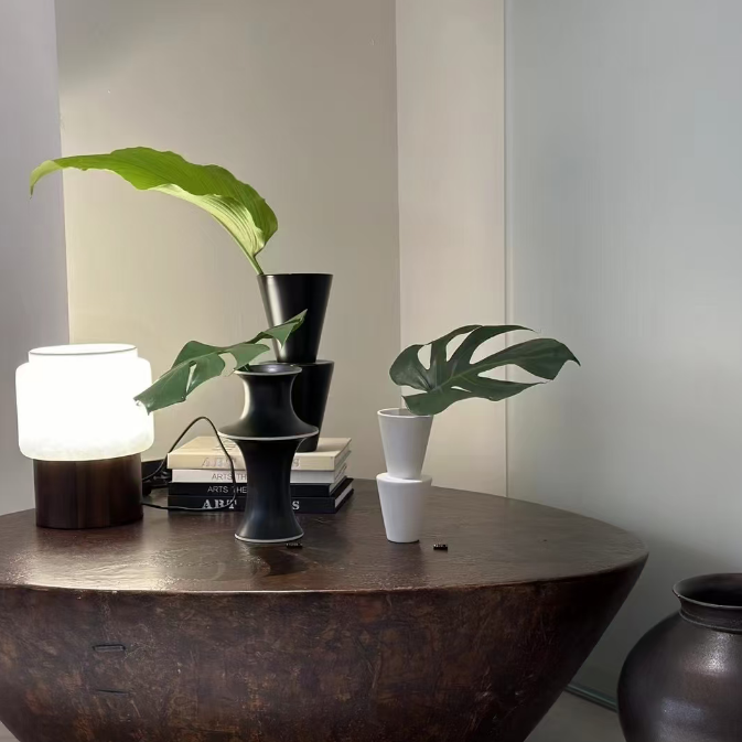 Walnut table lamp with rounded frosted shade and dark wood pedestal base