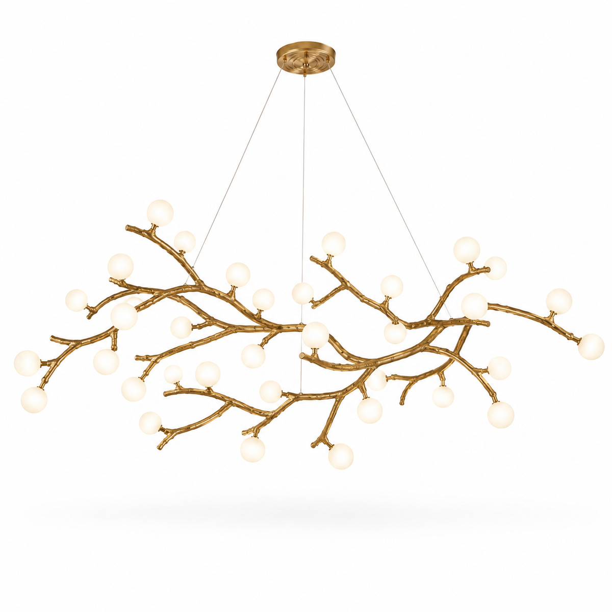 Gold branch chandelier with white globe bulbs and branching metal arms, suspended from round canopy