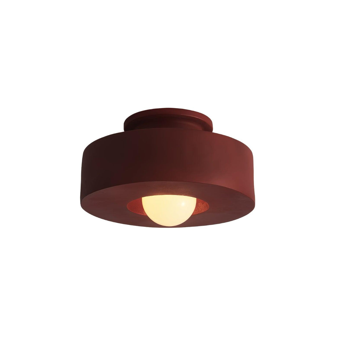 Brick red resin flush mount ceiling light with round shade and warm glowing bulb