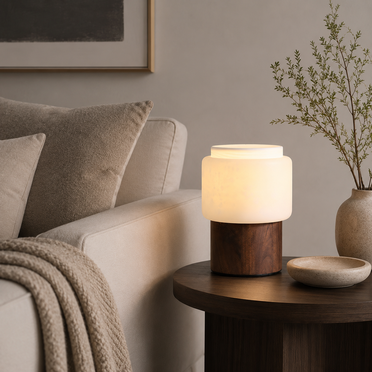 Walnut table lamp with frosted white shade and dark wood base, side angle