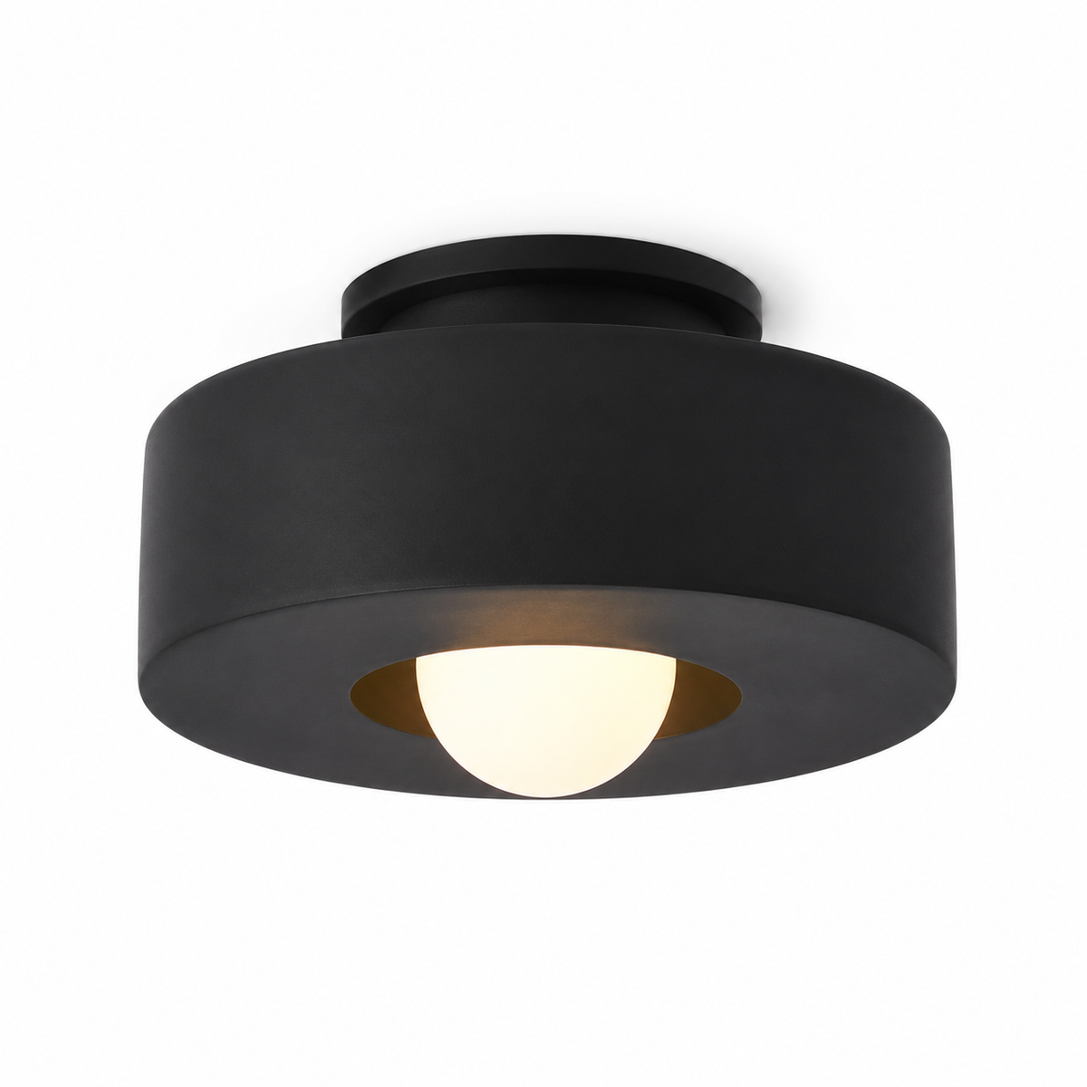 Black resin flush mount light with wide round shade and warm inner glow