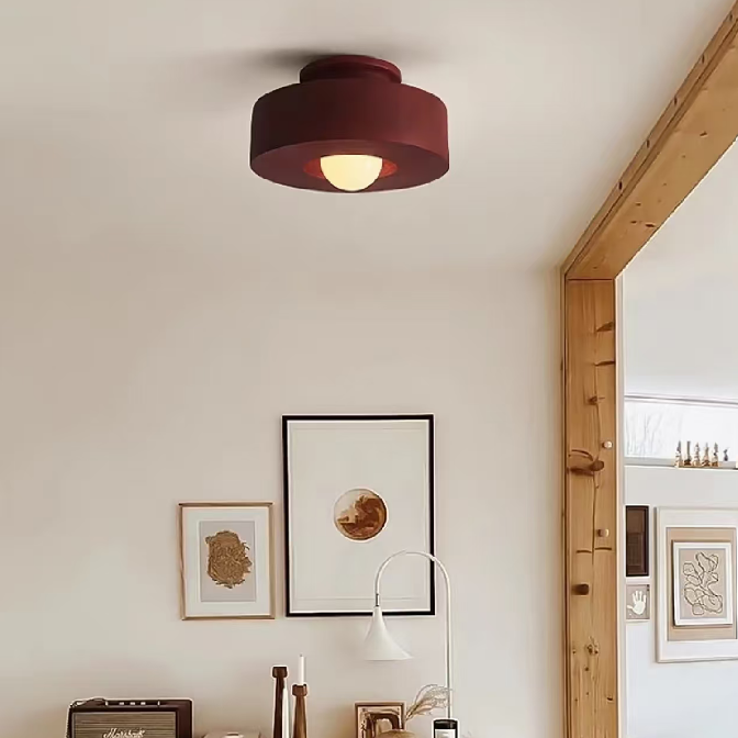 Brick red resin flush mount ceiling light with round shade and glowing center