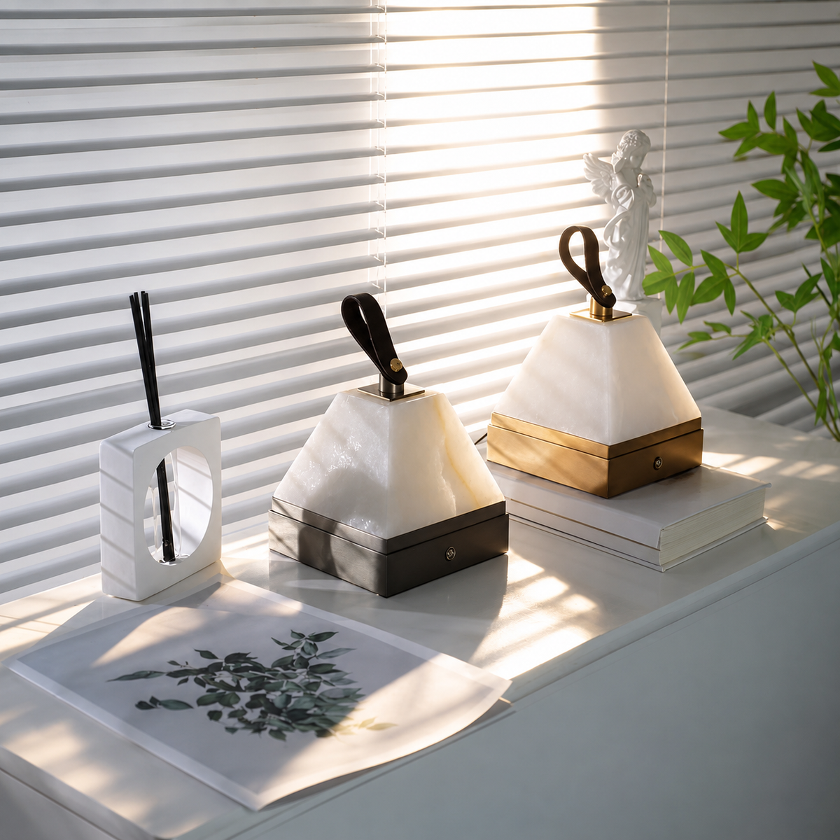 Pyramid alabaster portable table lamp, white pyramid shade on gold base with black stem