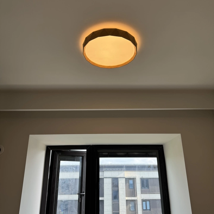 Walnut wood flush mount ceiling light with warm lit round diffuser