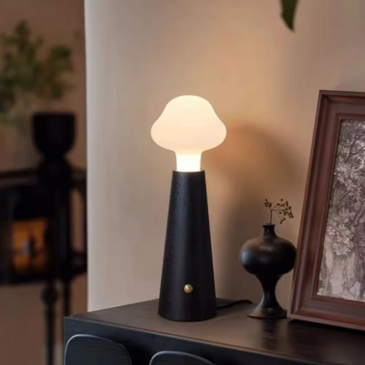 Cloud glass table lamp with matte black base and frosted globe shade