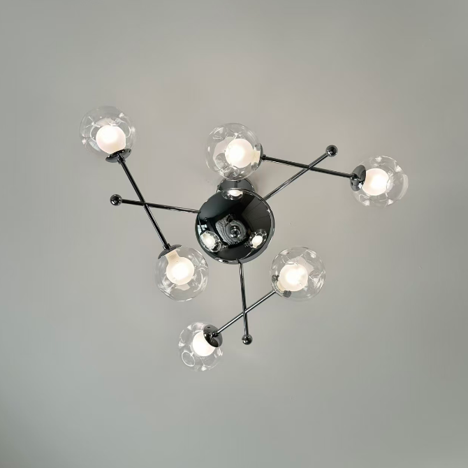 Starburst globe chandelier with clear glass bulbs and dark center fixture