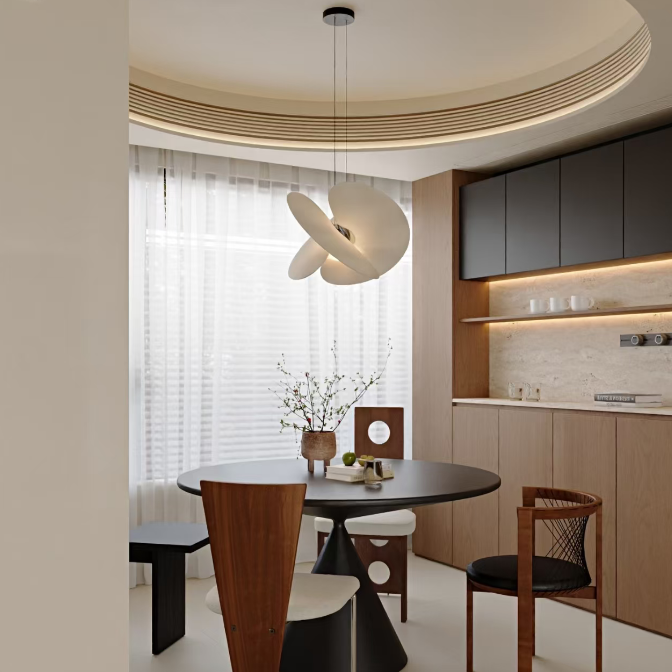 Butterfly pendant light with white dome shade and crossed blades over a kitchen table