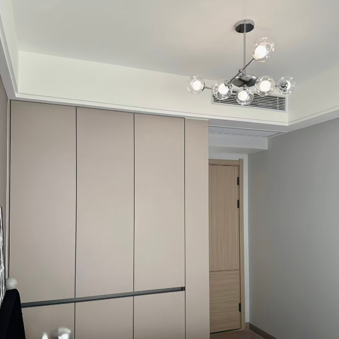 Small ceiling globe chandelier with clear glass shades and chrome frame