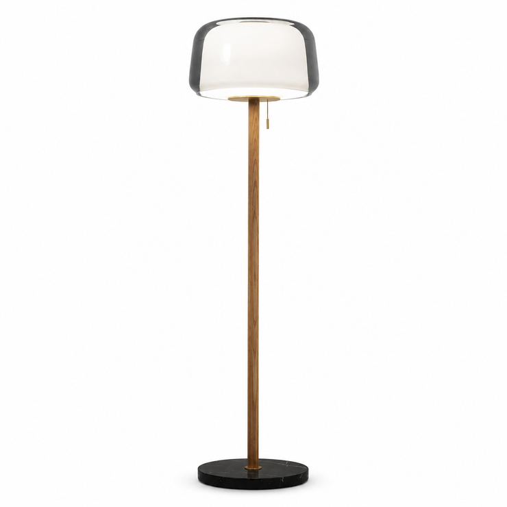 Floor lamp with smoked glass shade and tall wood column on a black round base