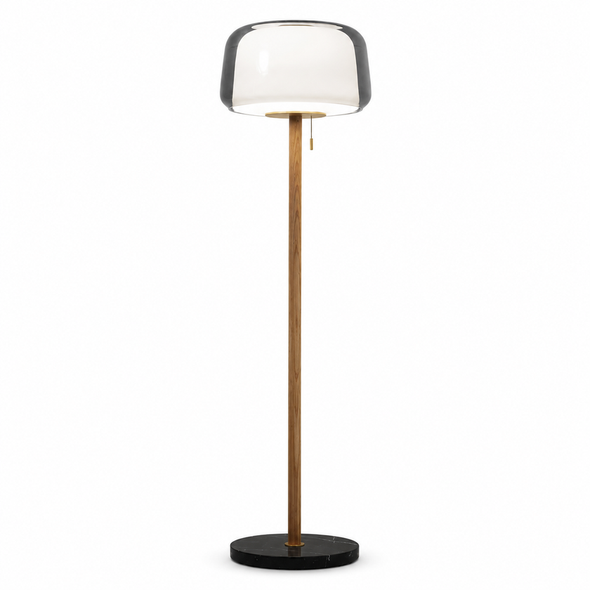 Floor lamp with smoked glass shade and tall wood column on a black round base