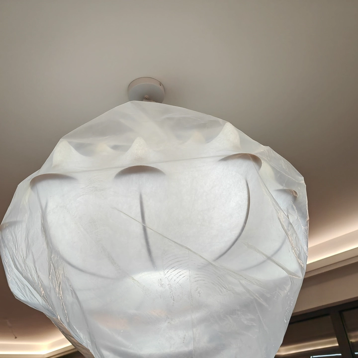 Close-up of white silk petal chandelier shade with layered, veined fabric texture