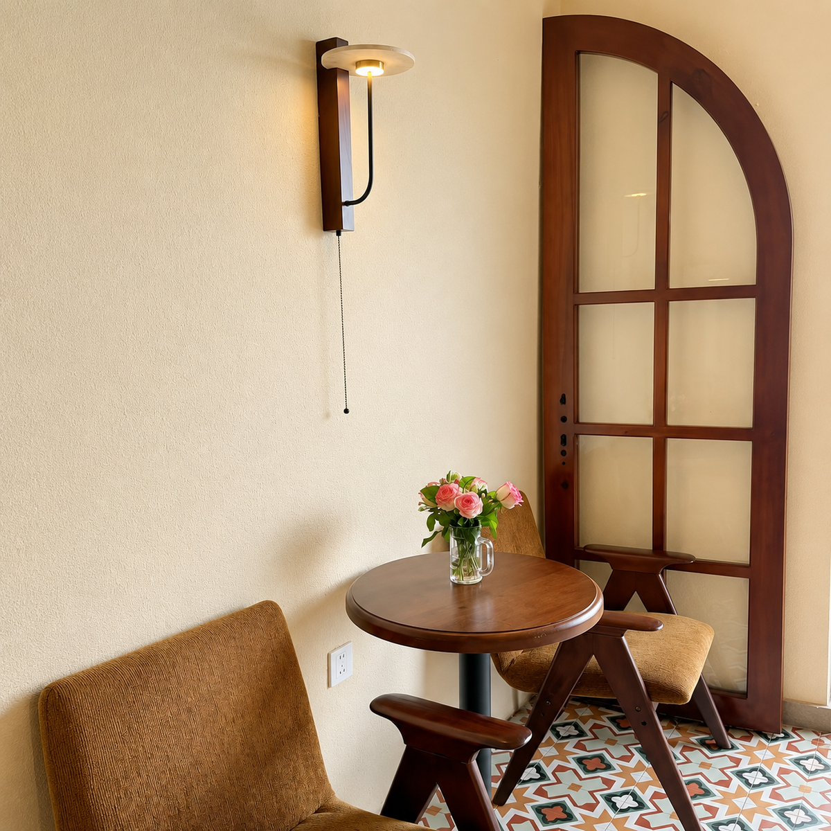 Wall-mounted wood sconce with black curved arm and exposed halo-style bulb