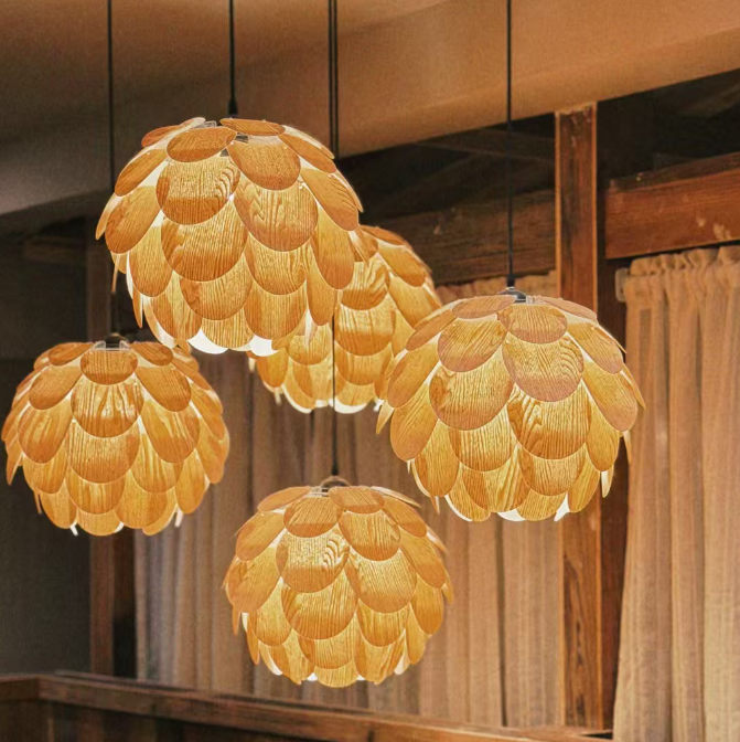 Four hanging pendant lights with textured, scalloped golden-yellow shades, suspended in a rustic wooden interior with wood paneling and curtains.