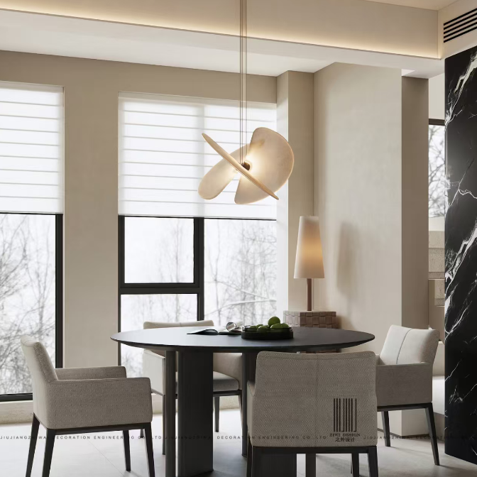 Butterfly pendant light with white dome shade and crossed blades above a round table