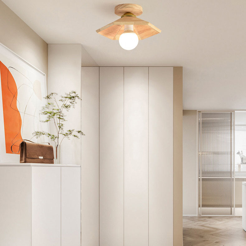 Light wood flush-mount ceiling light with stacked cone shade and frosted bulb globe