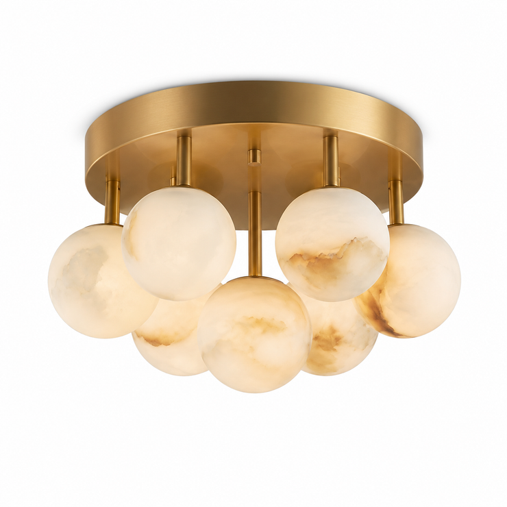 Gold flush-mount ceiling light with clustered white alabaster-style glass globes