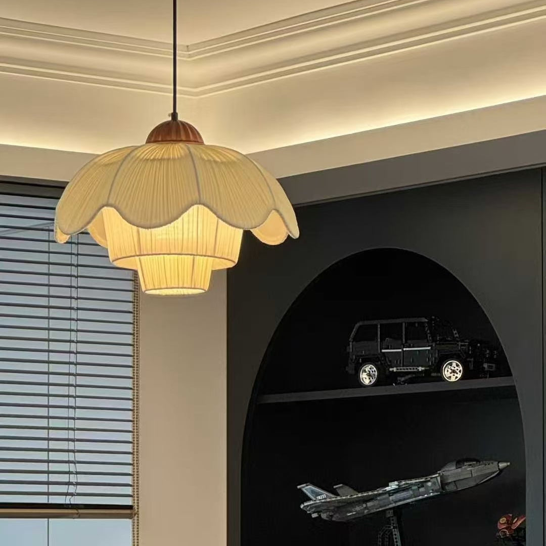 French linen pendant light with scalloped petal shade and brown cord, warm glow.