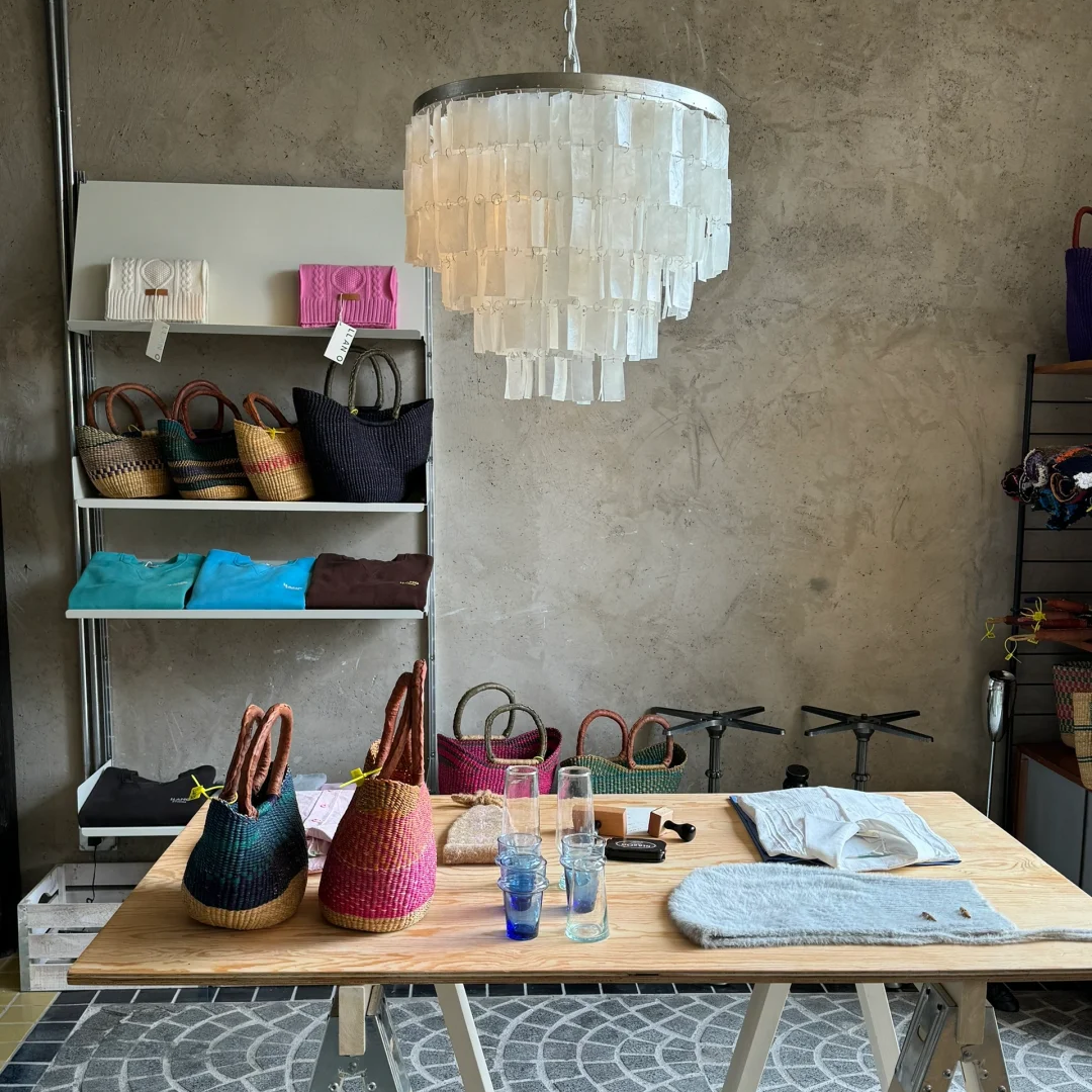 Capiz shell tiered chandelier over worktable with accessories