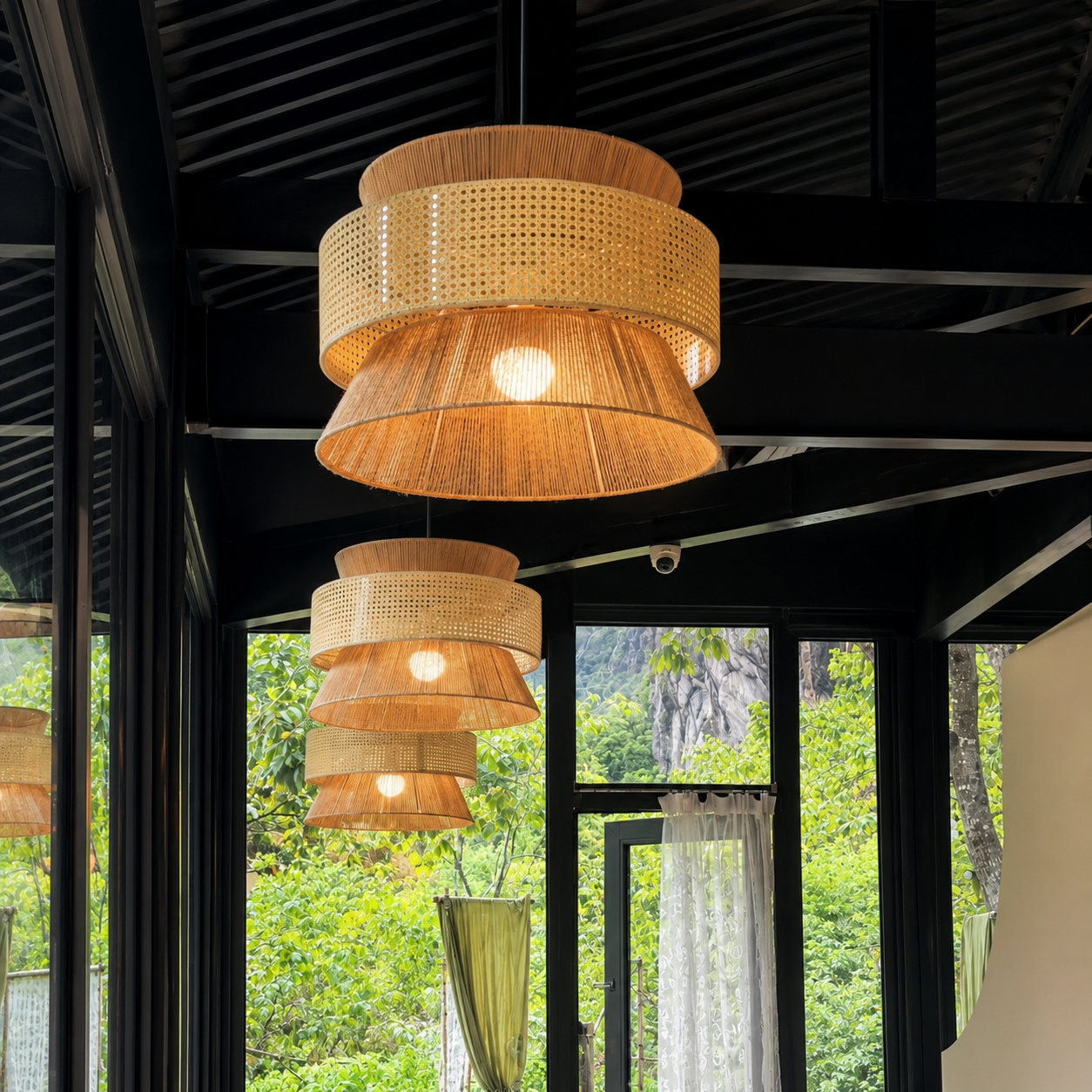 Multiple woven hourglass pendant lights with perforated bands and warm-toned shade