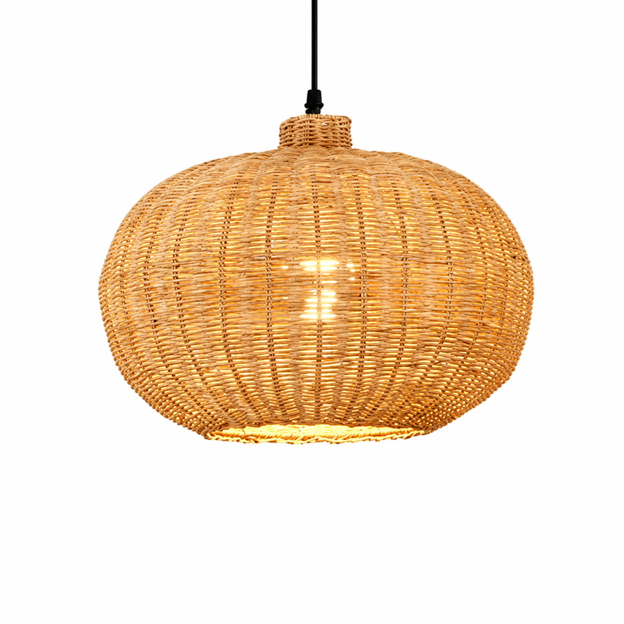 Rattan pumpkin-shaped pendant light with black cord and warm glowing bulb.