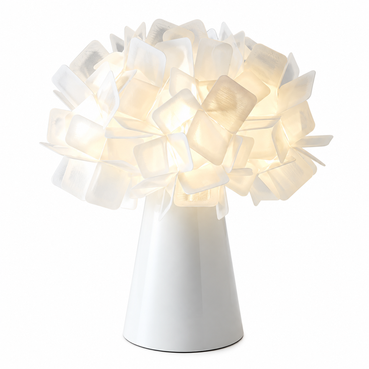 White geometric blossom table lamp with glowing white cube shade