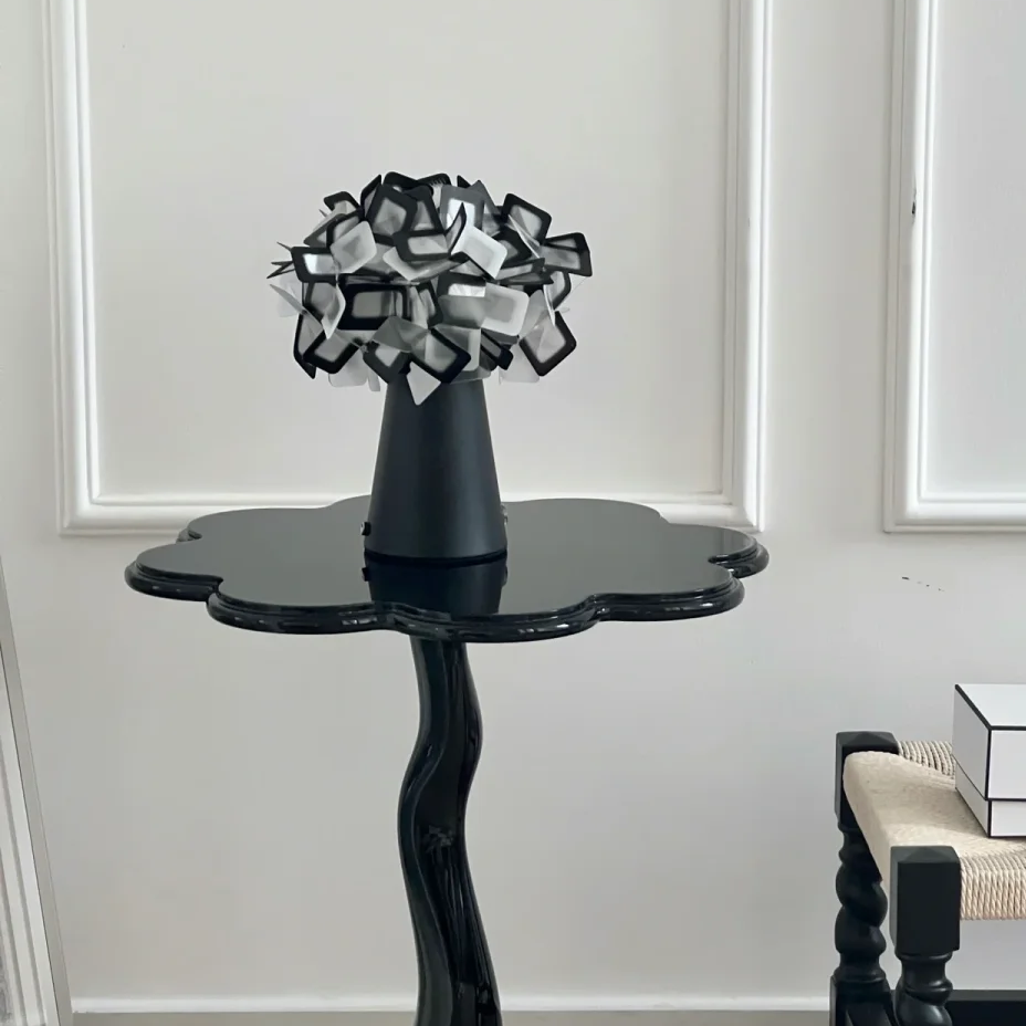 Black geometric blossom table lamp with sculpted cube shade
