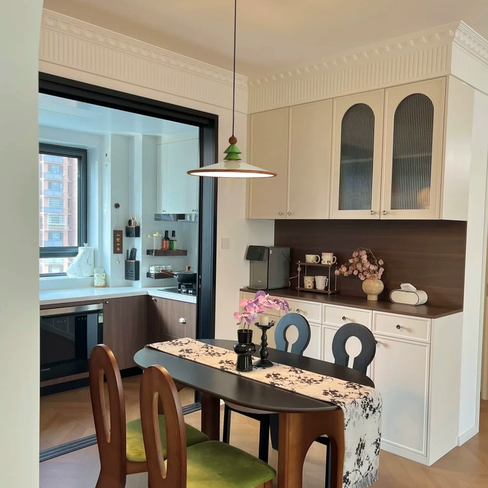 Brass ring pendant light with green cone pine shade and brown stem finial.