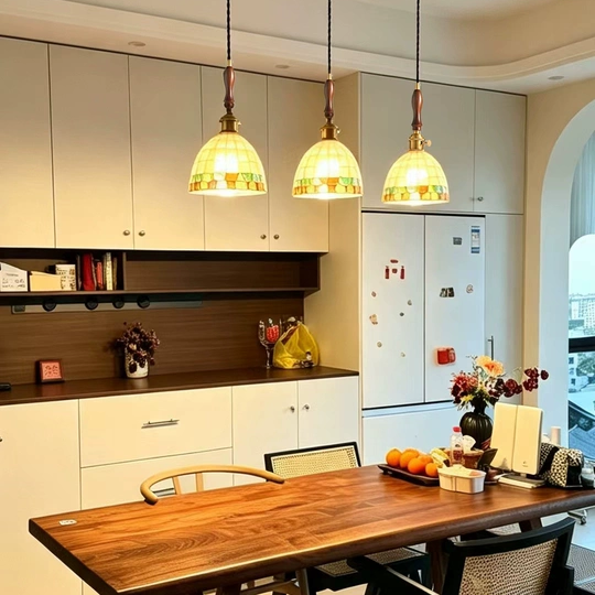 Mini pendant light set with warm mosaic glass shades and antique brass caps