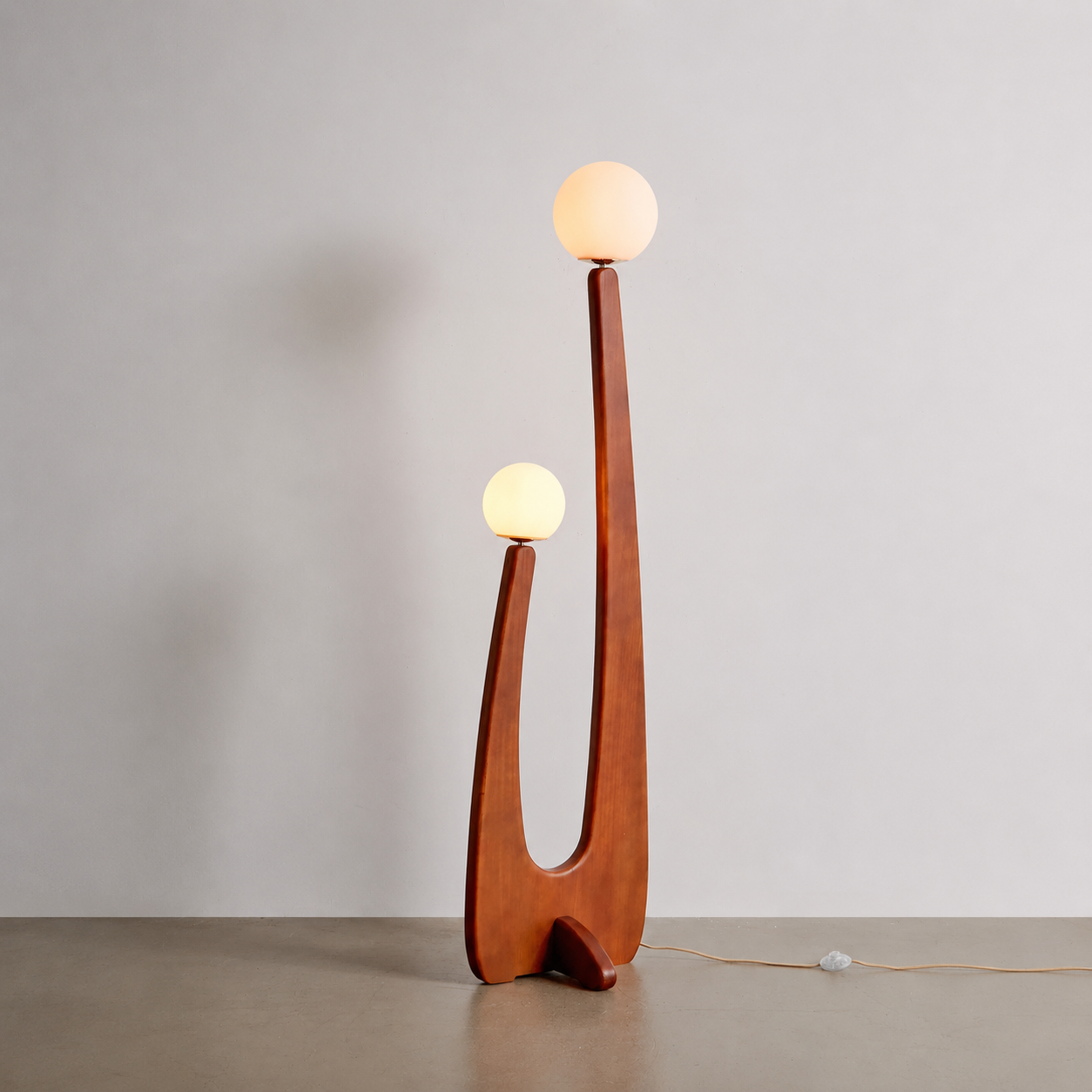 Cactus floor lamp with two round globe shades on curved wooden base