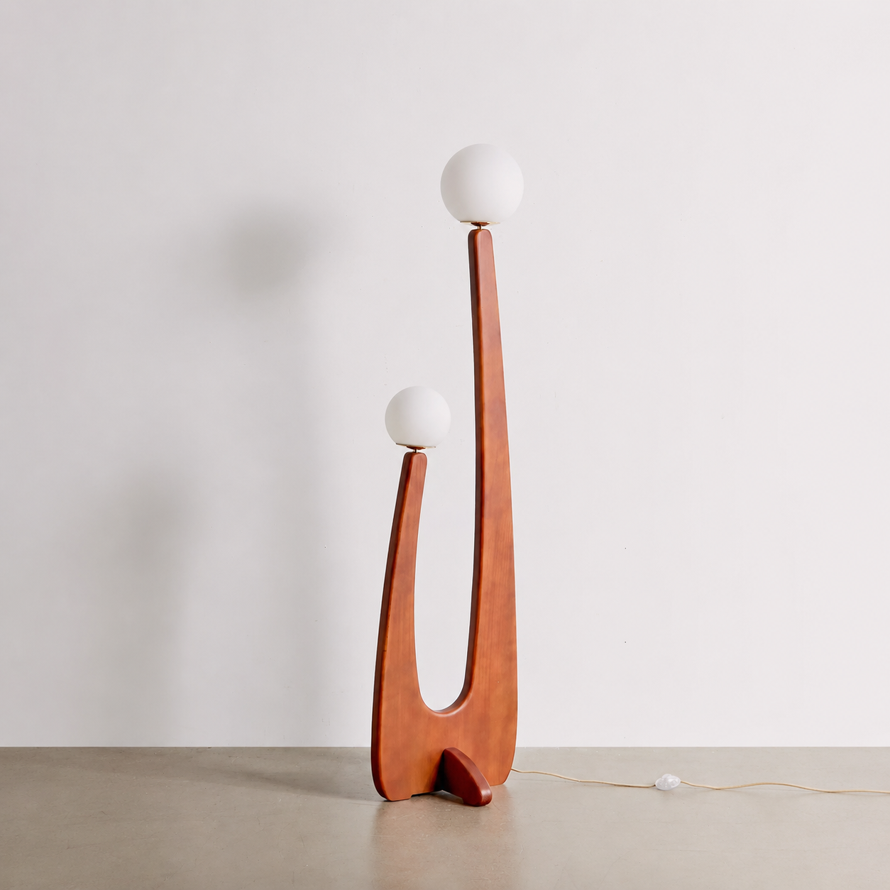 Cactus floor lamp with tall curved wood frame and two round globe shades