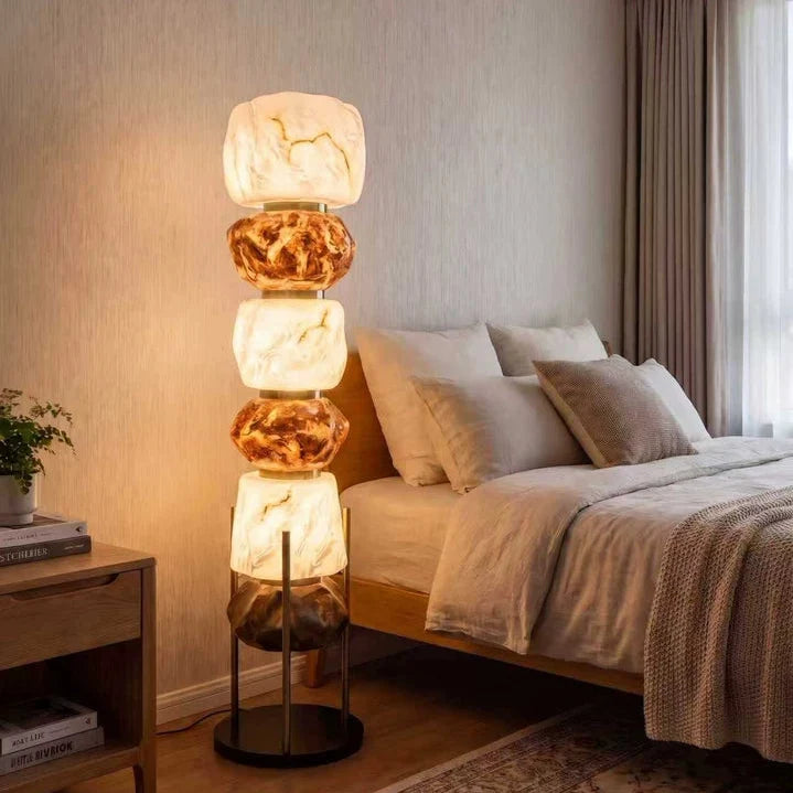 Stacked resin totem floor lamp with warm amber and white resin shades and thin metal legs