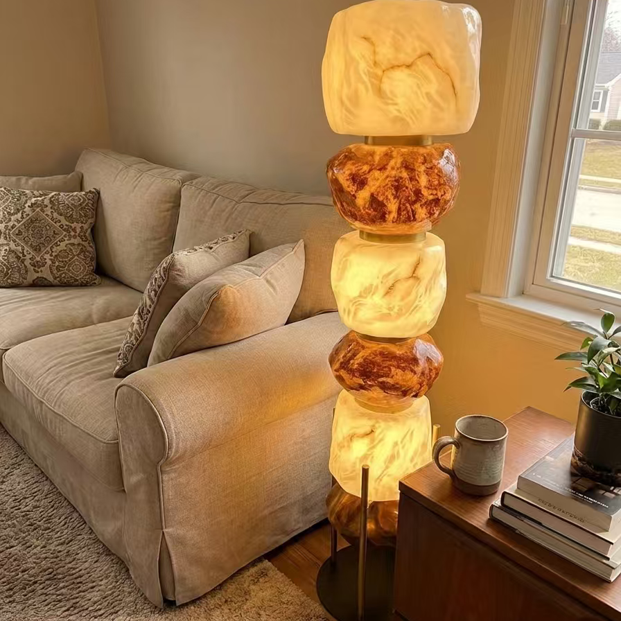 Stacked resin totem floor lamp with amber and white resin stacked shades on dark base