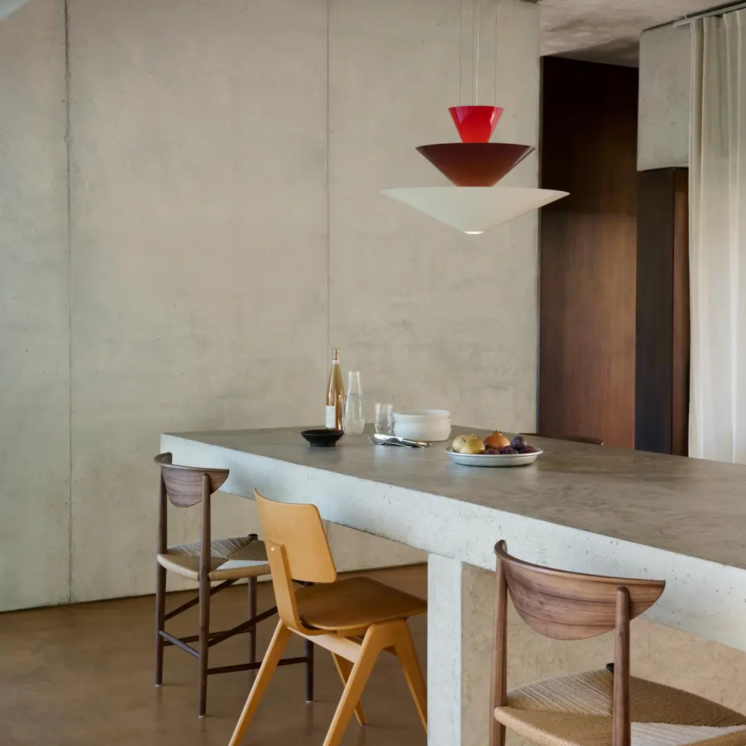Tiered geometric cone pendant light with red top cone and white tiered shades