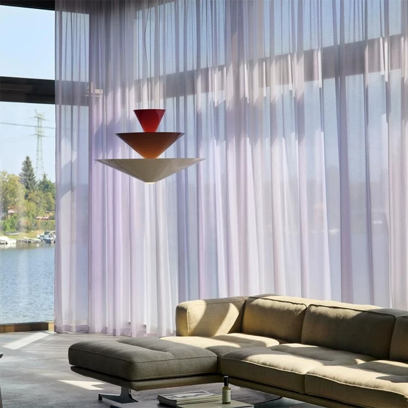 Tiered geometric cone pendant light with layered red and warm white cones