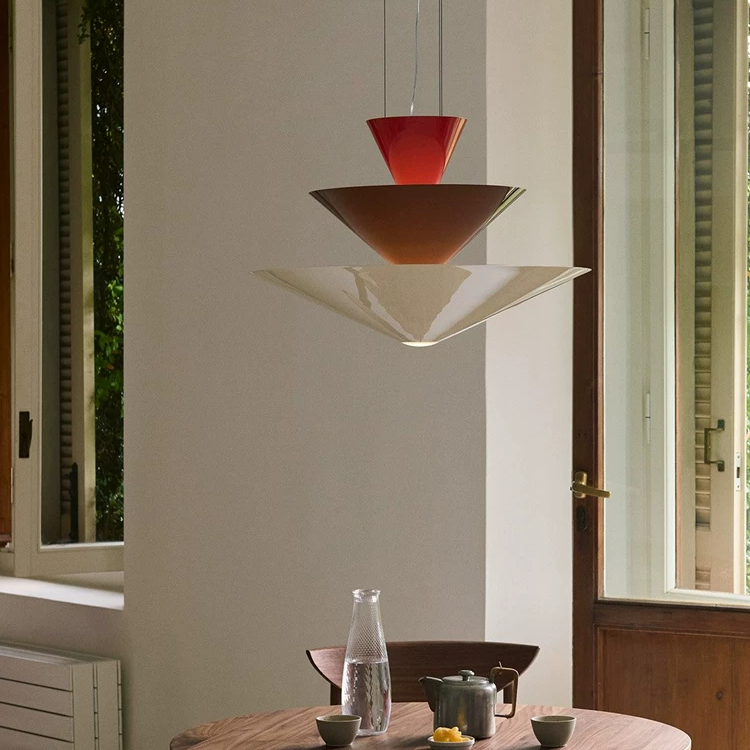 Tiered geometric cone pendant light with red top cone and white lower cones