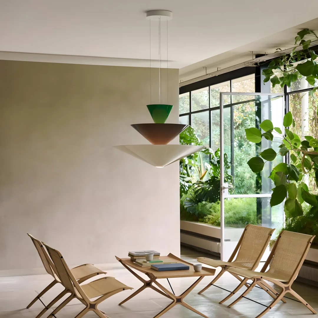Green and dark tiered cone pendant light with three stacked shades
