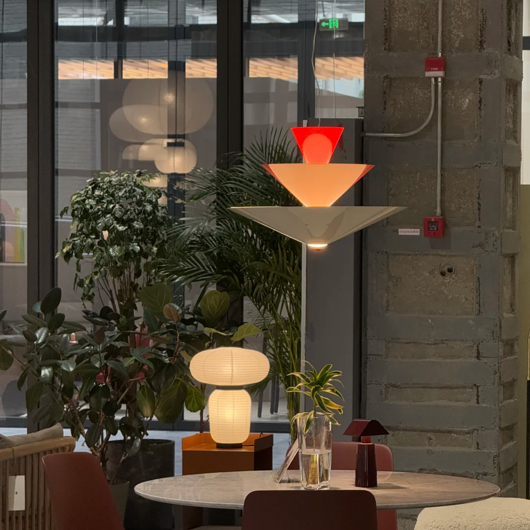 Tiered geometric cone pendant light with red and warm white glow