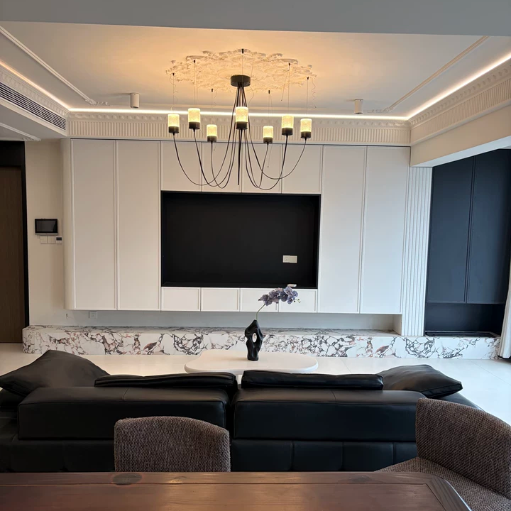 Catenary drape chandelier overhead view with black stems and several cylindrical fabric shades