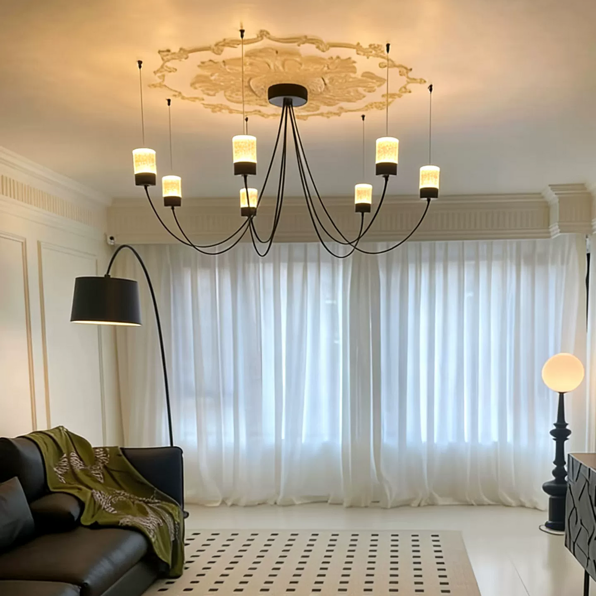 Sculptural catenary chandelier with black rim canopy and multiple dangling cylinder fabric shades
