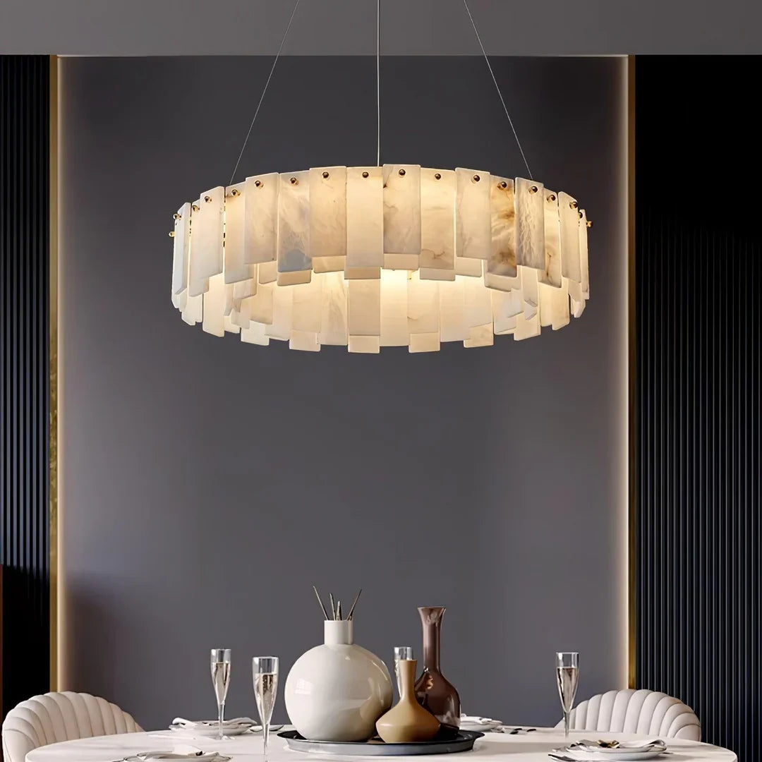 Overhead disc chandelier with frosted glass panel shades and brass ceiling canopy