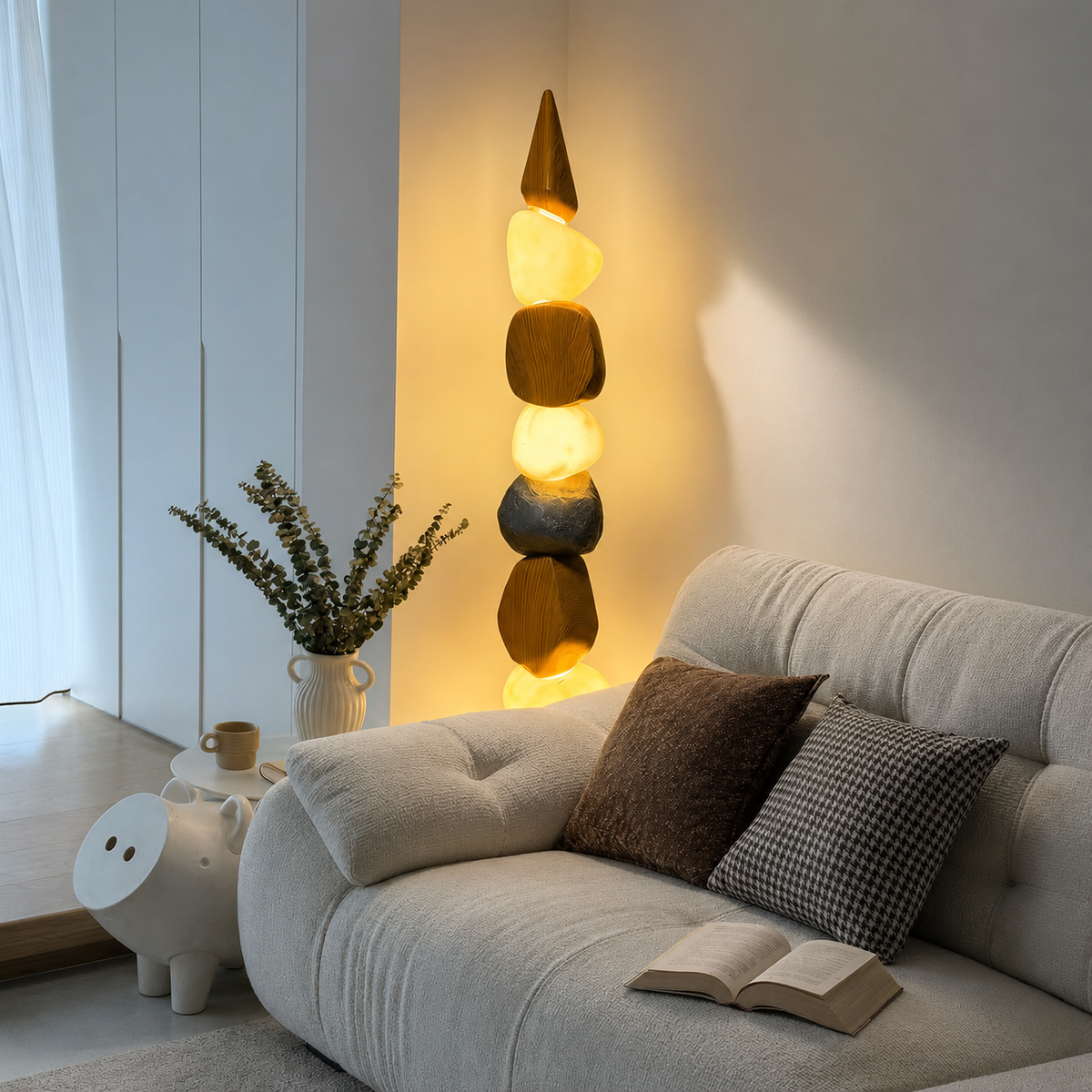 Pebble-style floor lamp with warm glowing stones and round wooden base