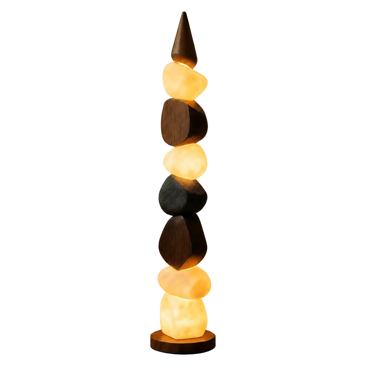 Stacked pebble floor lamp with warm glowing stone shades and round wooden base
