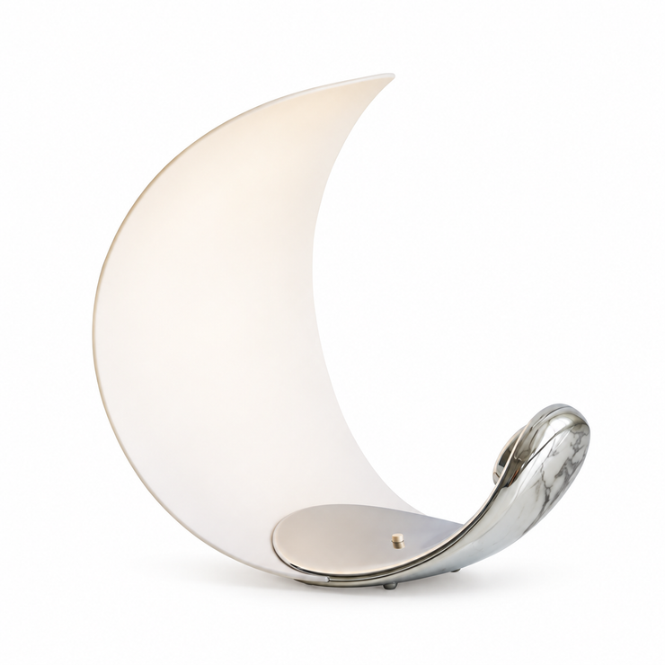 Crescent moon table lamp with frosted white shade and curved chrome base