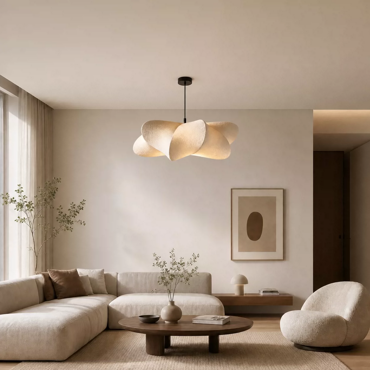 Cream beige sculptural silk petal pendant light hanging above minimalist living room seating