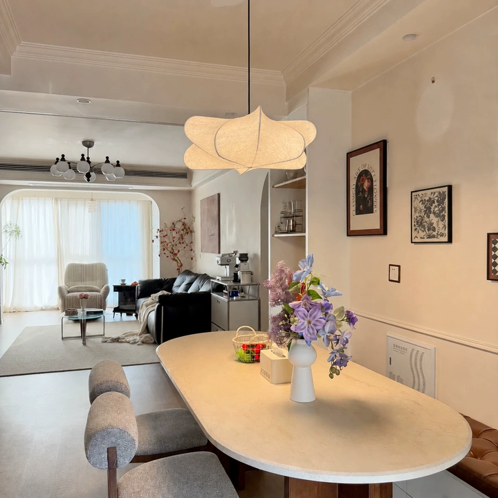 Sculptural silk petal pendant light with curved beige fabric petals and central hanging stem