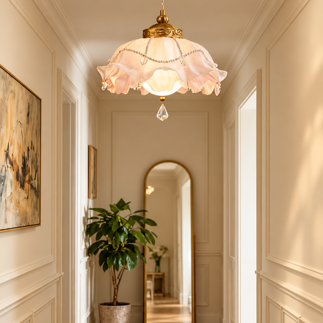 Ruffled glass pendant light with pink scalloped shade, brass finial, crystal prism
