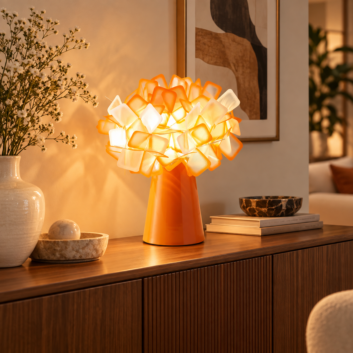 Orange geometric blossom table lamp with glowing cube blossom shade