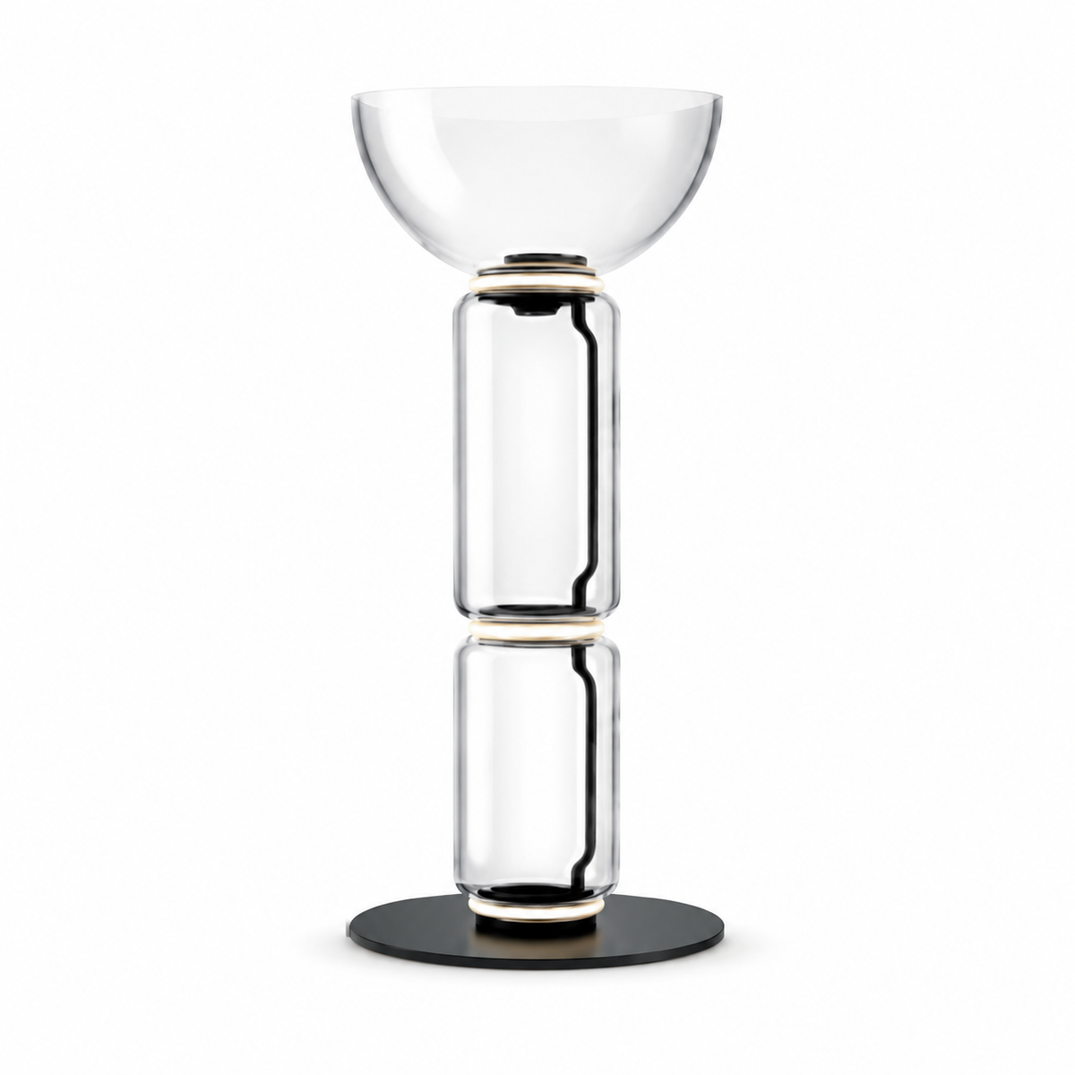 Clear glass floor lamp with drum-style top, stacked glass body, and black base