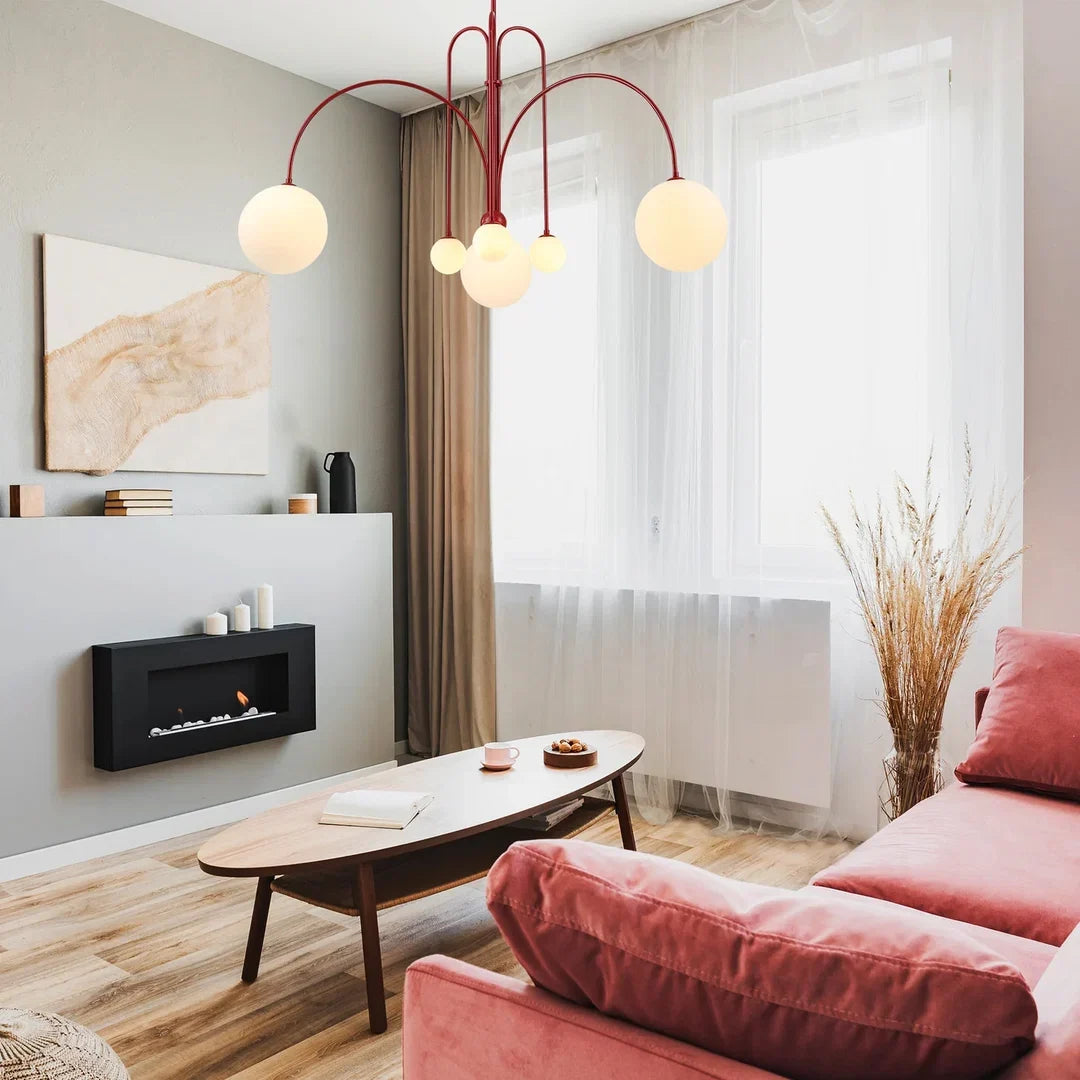 Red multi-arm chandelier with multiple white globe bulbs and arched metal frame